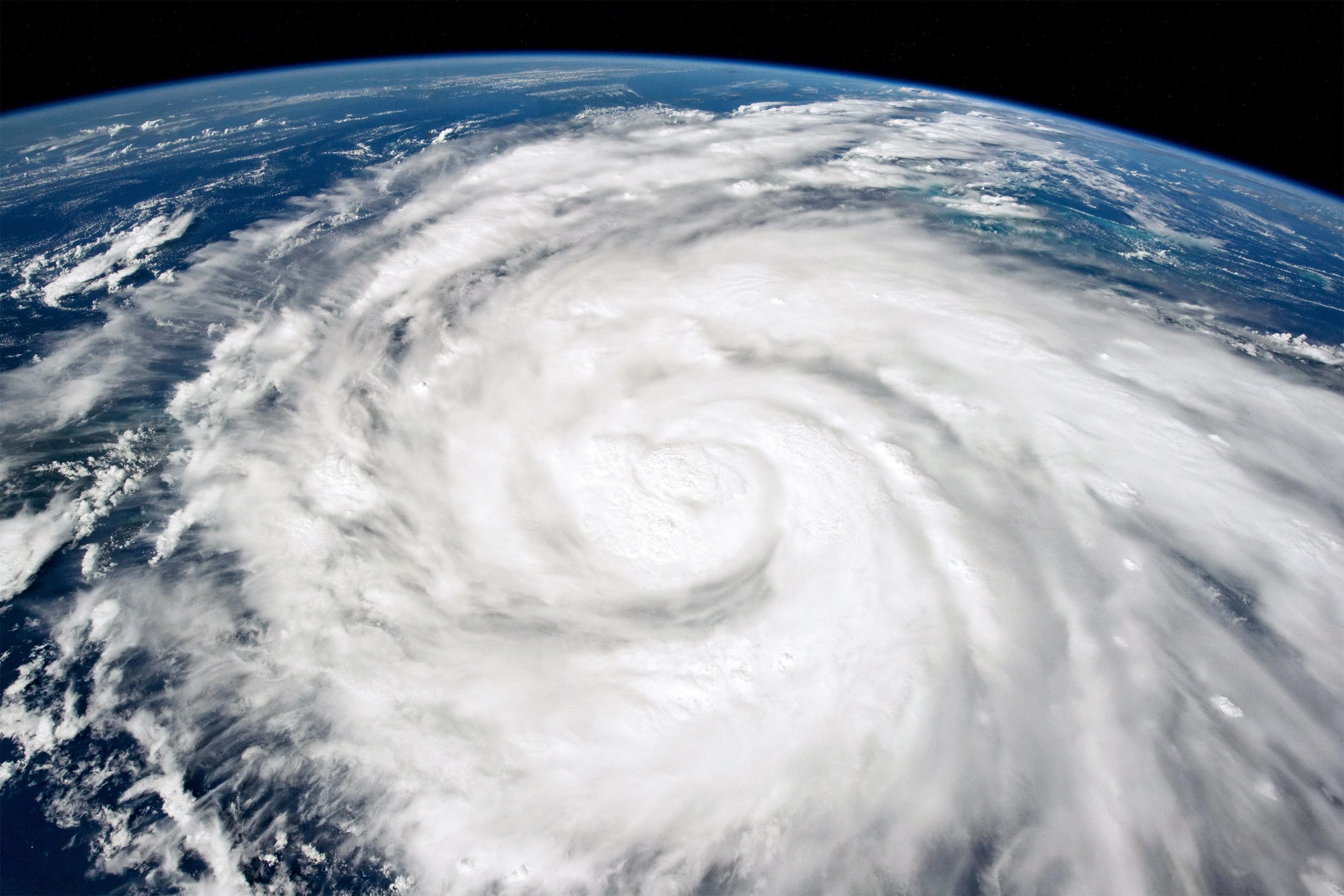Photo of a storm from the ISS showing an oblique view of the storm’s eye.